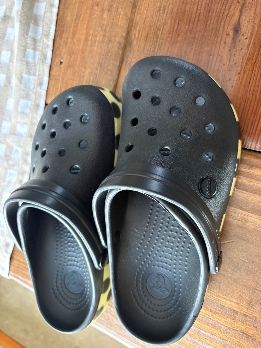 CROCS Kids Black Foam Clogs with Yellow Trim